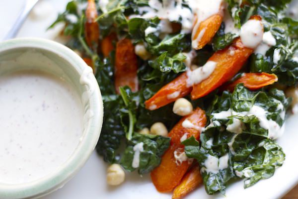 kale salad with roasted carrots, chickpeas + spiced tahini dressing